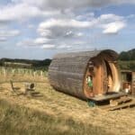 Barrel-shaped glamping pod with round door and outdoor kitchen, Kent
