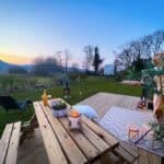 Decking with picnic table and mountain views at dusk, Erw Glas, north Wales