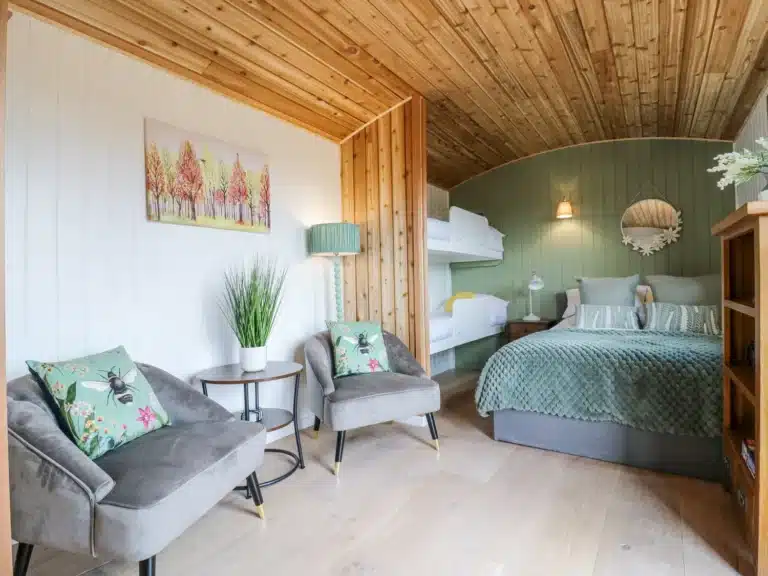 Bedroom in a shepherds hut at Shepherds hut at night at Lodeside Glamping Cambridgeshire