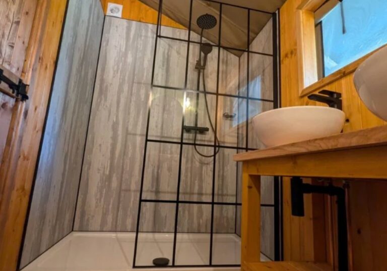 Shower inside safari tent Skelwith Fold Park Ambleside