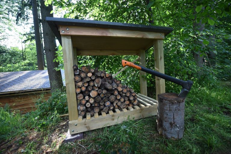 Log store beside the Treetop Cabin, with firewood provided for the stove and fire pit