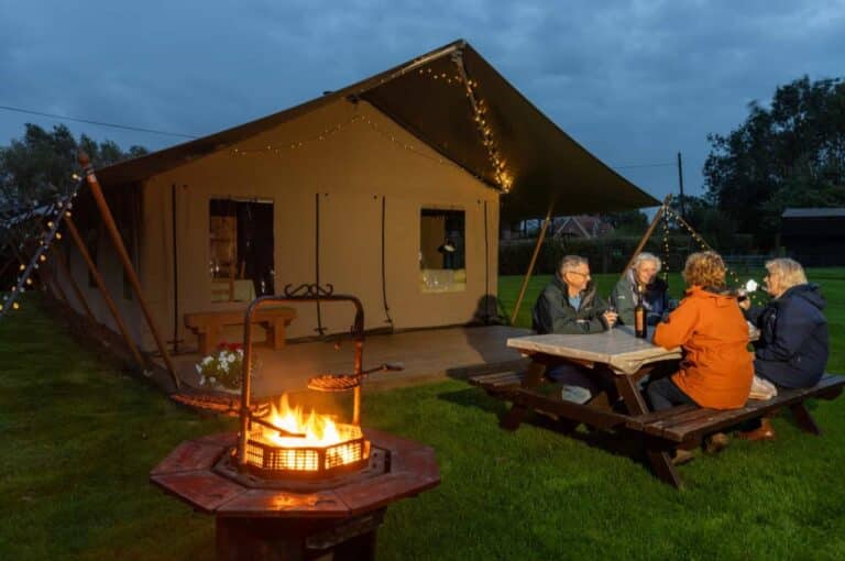 Safari tent at night Down Chorus Glamping near Southwold with fire pit