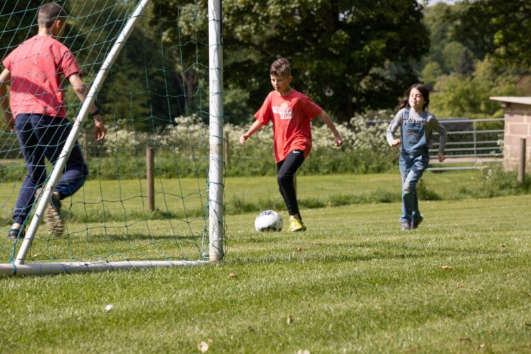 Kids playing football at Notgrove Holidays The Cotswolds