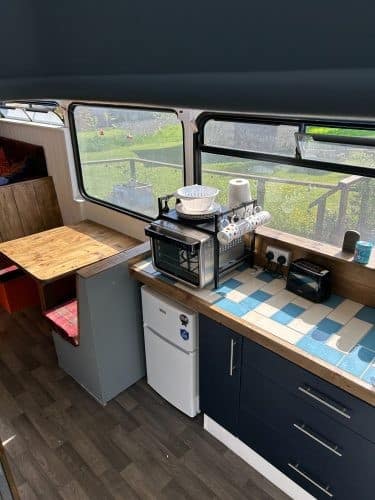 Kitchen in quirky converted London Bus for glamping at Bracken Barns Scotland