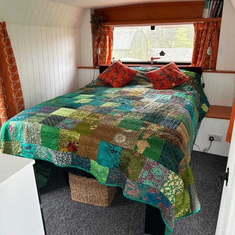 Bedroom in quirky converted London Bus for glamping at Bracken Barns Scotland
