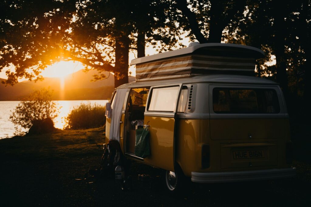 A campervan looking out to sunset by Kevin Schmid