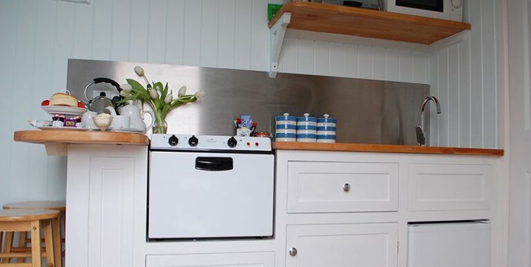 Kitchen in a shepherds hut at To Rest A While GlampingSomerset