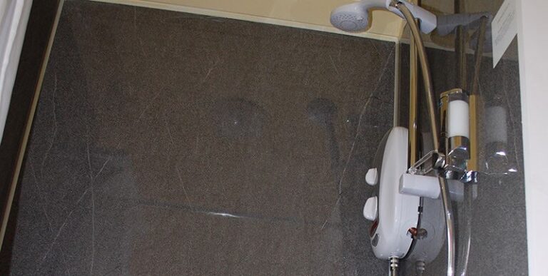 Shower in a shepherds hut at To Rest A While Glamping Somerset