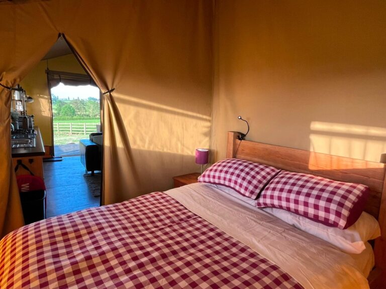 Bedroom in a safari tent at Village Farm Hideaway Leicestershire