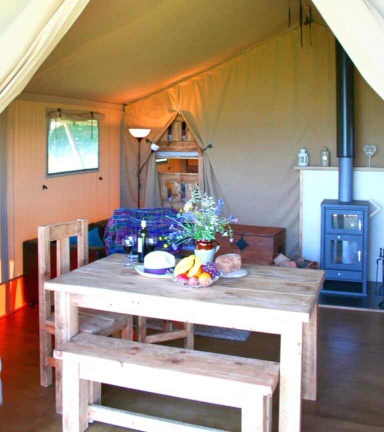 Inside a safari tent at Village Farm Hideaway Leicestershire