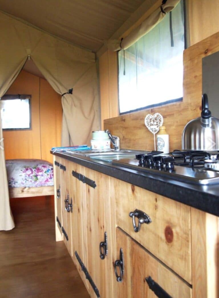 Kitchen and cabin bed in a safari tent at Village Farm Hideaway Leicestershire