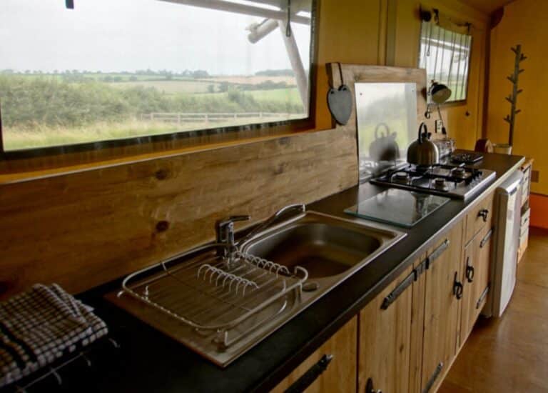 Kitchen in a safari tent at Village Farm Hideaway Leicestershire
