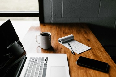 office desk and laptop writing a blog