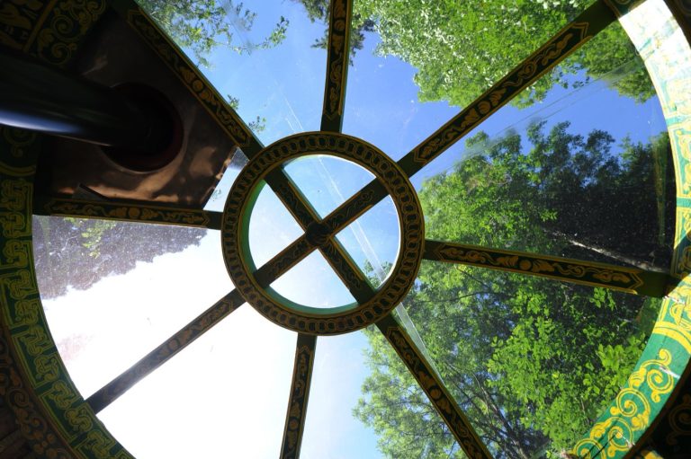 Looking up through the crown wheel of a yurt at Redwood Valley to the trees above